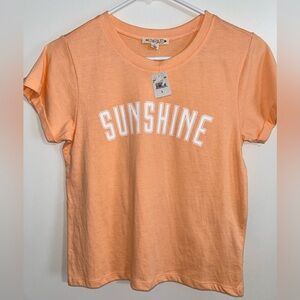 Orange pullover. New with tag. Brand Love Dazed. Size L.